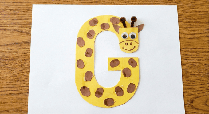 Letter G activities: giraffe craft using letter G shape with spotted pattern collage