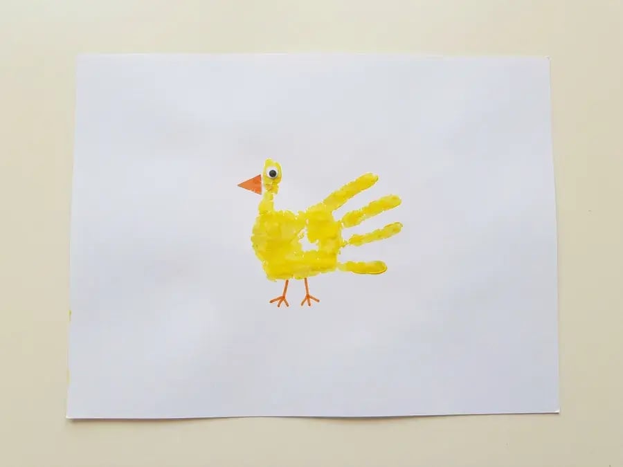 Handprint chick, an easy farm craft for preschoolers ages 3 to 5