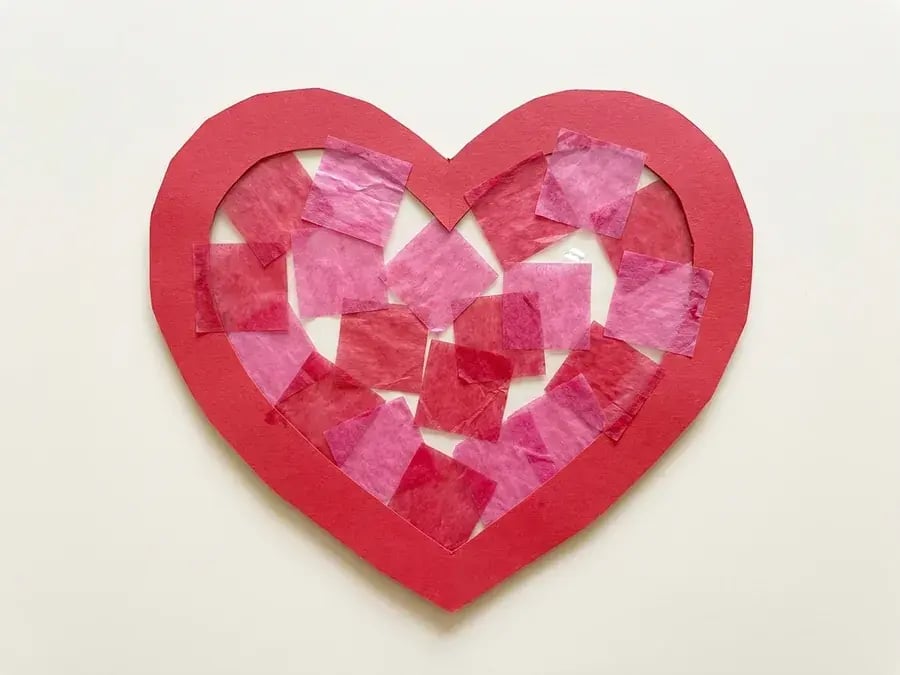Tissue paper heart suncatcher, an easy February craft for preschoolers ages 3 to 5