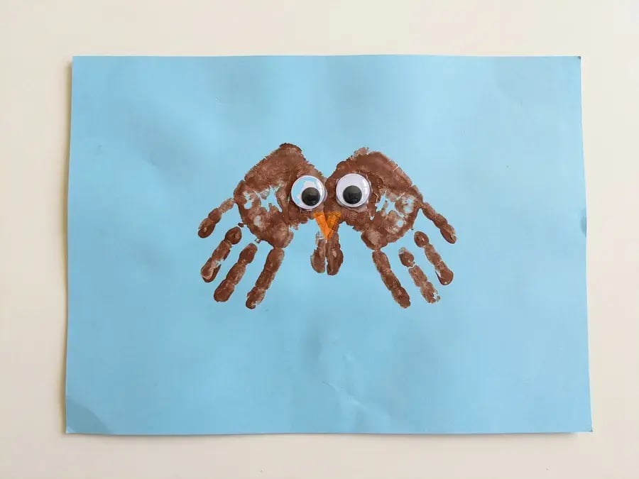 Handprint owl, an easy owl craft for preschoolers ages 3 to 5