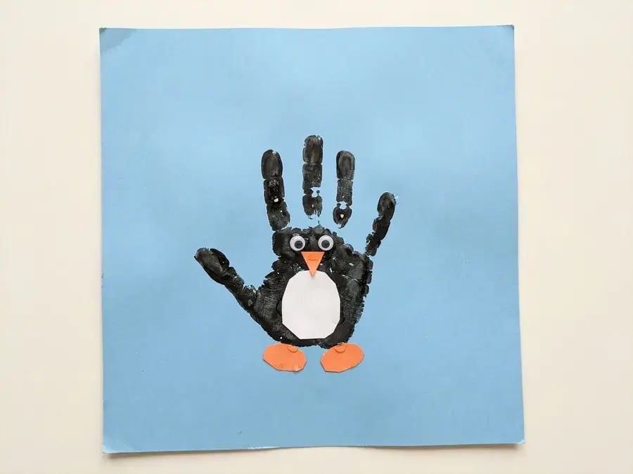 Handprint penguin, an easy January craft for preschoolers ages 3 to 5