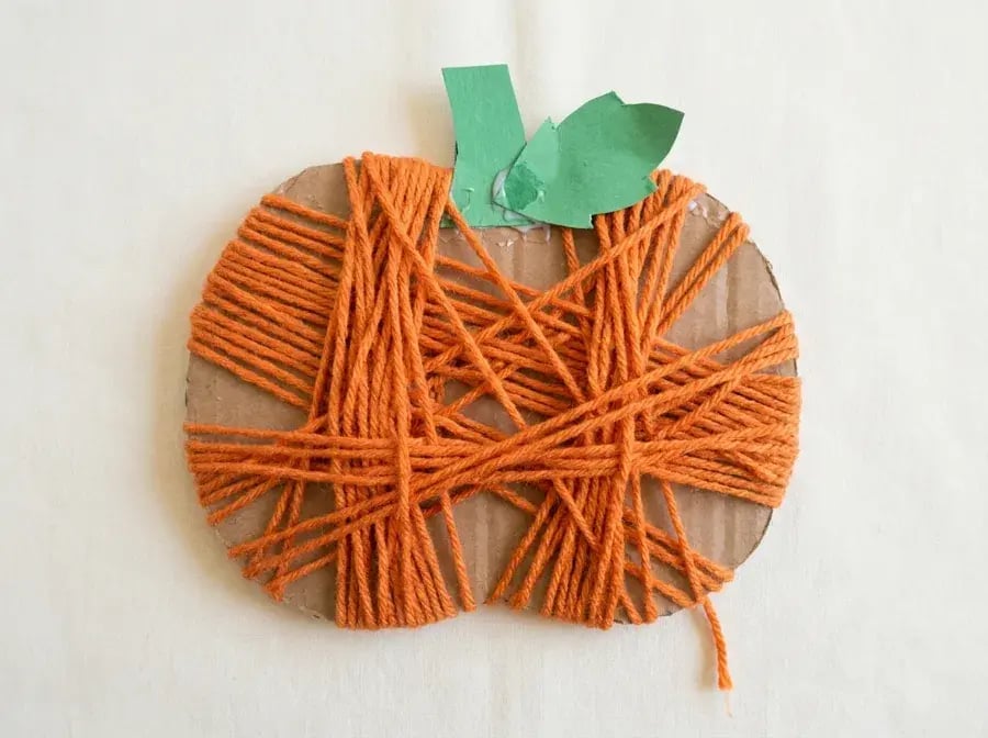 Yarn wrapped pumpkin, an easy pumpkin craft for preschoolers ages 3 to 5