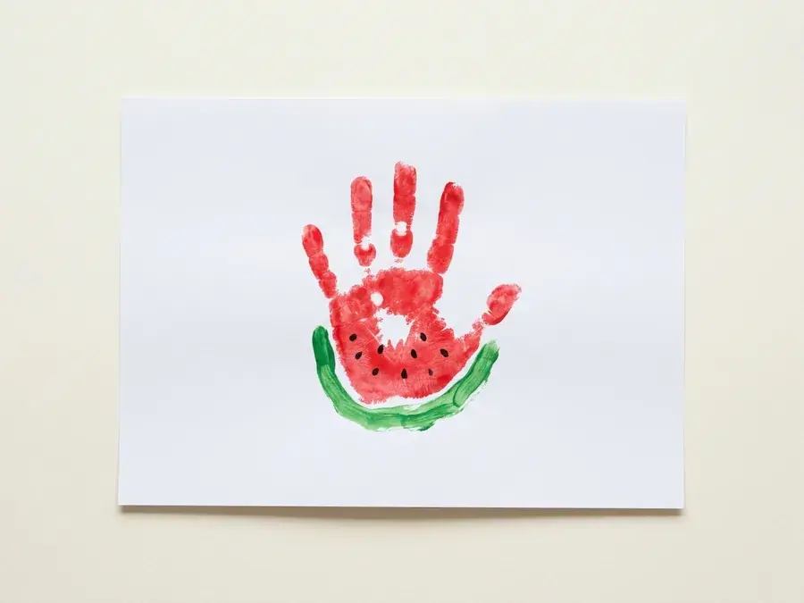 Handprint watermelon, an easy watermelon craft for preschoolers ages 3 to 5