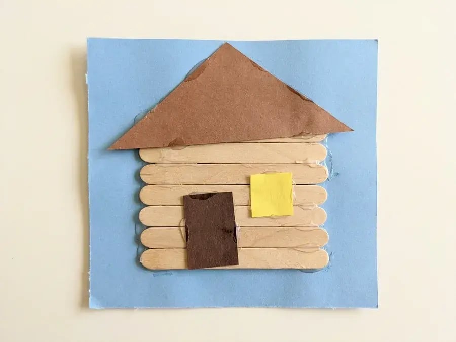 Craft stick log cabin, an easy February craft for preschoolers ages 3 to 5
